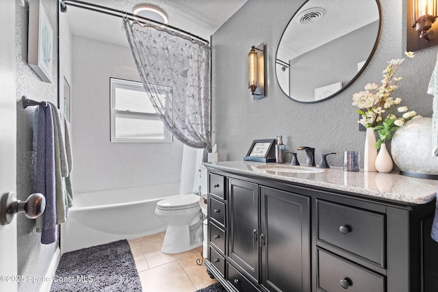 full bath with a textured wall, tile patterned flooring, toilet, shower / tub combo, and vanity