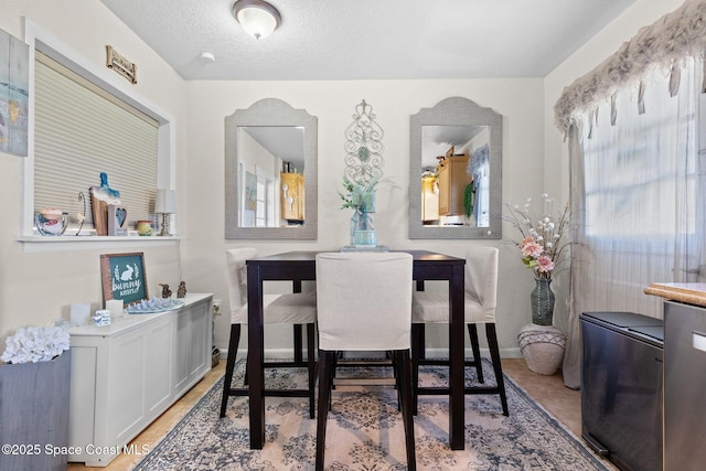 dining area with a textured ceiling