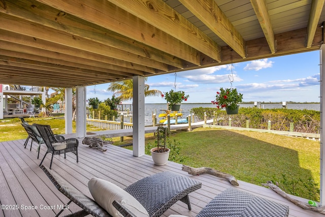 deck featuring a water view and a yard