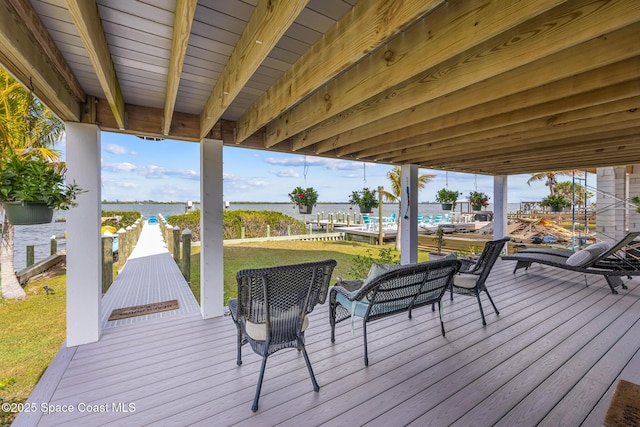 wooden deck featuring a water view