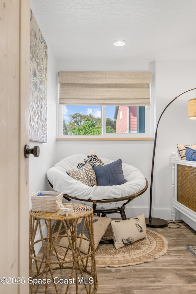 sitting room featuring recessed lighting, wood finished floors, and baseboards