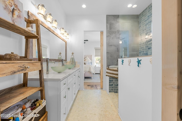 ensuite bathroom featuring recessed lighting, ensuite bath, a walk in shower, and vanity