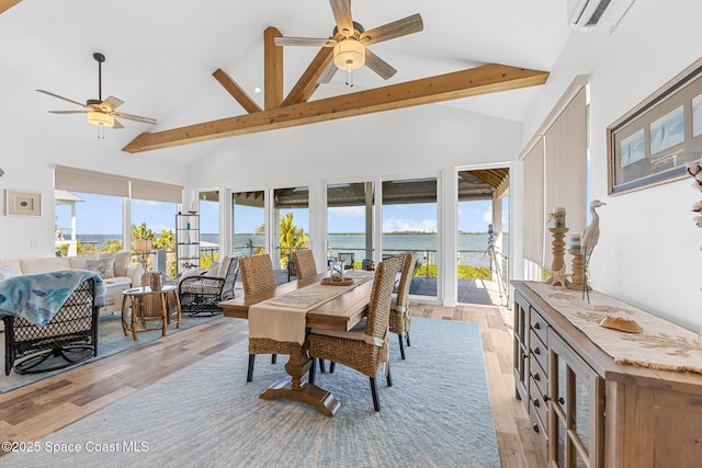 dining room with high vaulted ceiling, light wood finished floors, beamed ceiling, and a ceiling fan