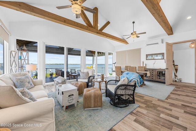 living room with high vaulted ceiling, wood finished floors, a ceiling fan, an AC wall unit, and beamed ceiling