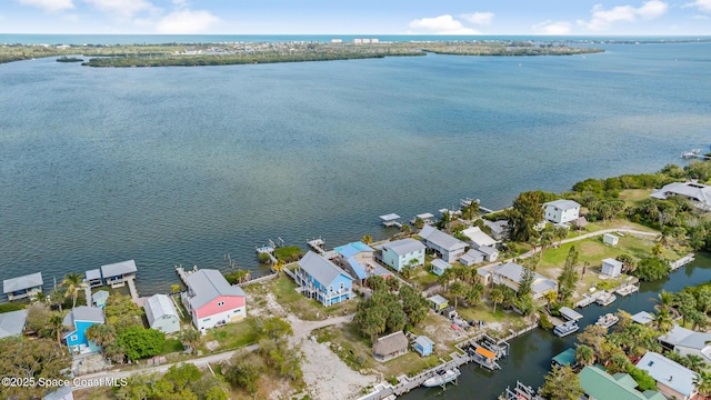 birds eye view of property featuring a water view and a residential view