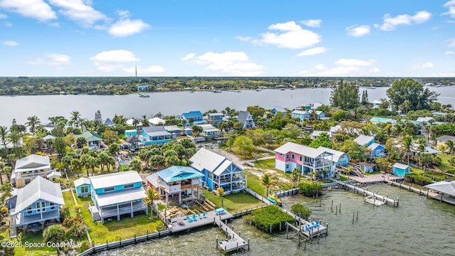 drone / aerial view with a water view and a residential view