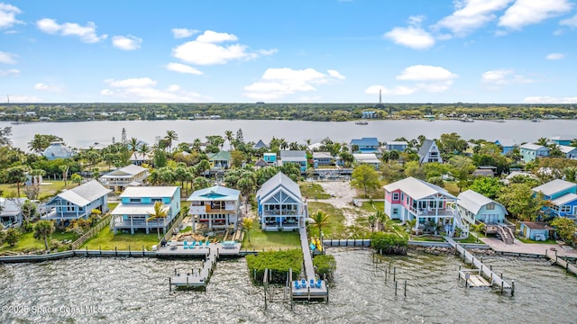 birds eye view of property featuring a water view and a residential view