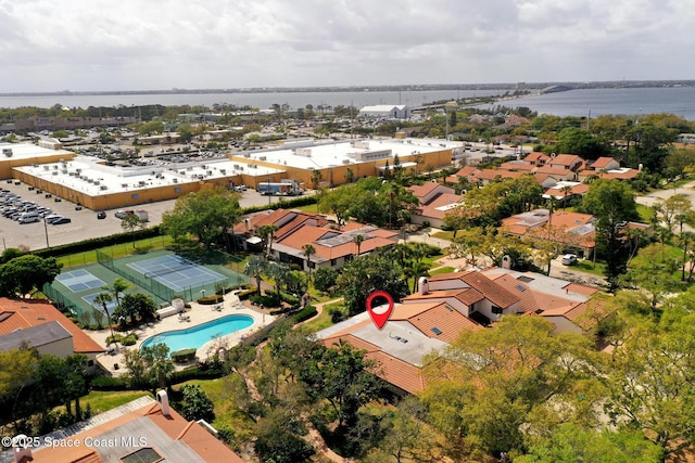 birds eye view of property with a water view