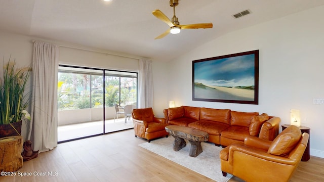 living area with light wood-type flooring, ceiling fan, visible vents, and lofted ceiling