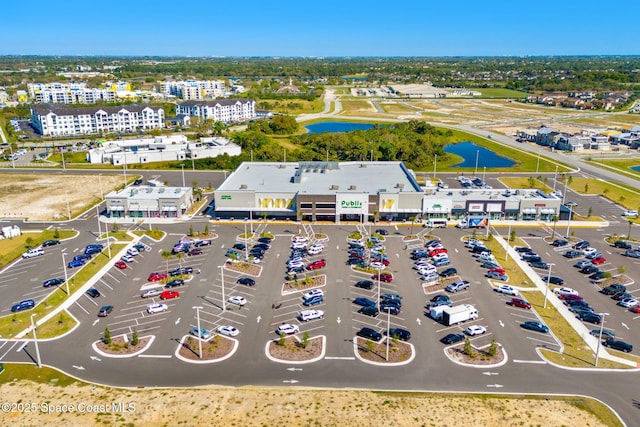 birds eye view of property featuring a water view