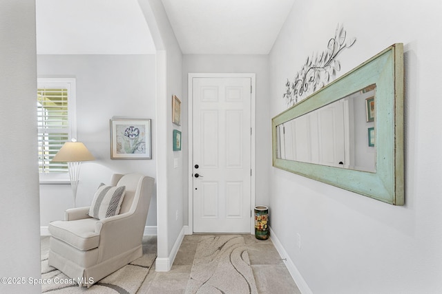 entryway featuring baseboards