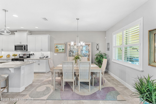 dining room with visible vents, recessed lighting, baseboards, and a chandelier