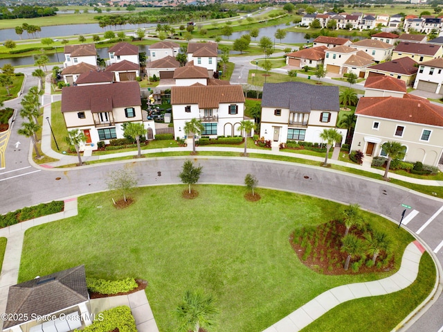 aerial view featuring a residential view and a water view