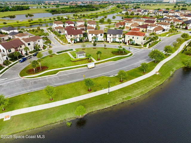 birds eye view of property featuring a residential view and a water view