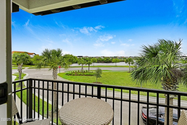 balcony featuring a water view