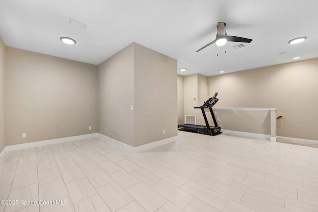 exercise area featuring baseboards, visible vents, and ceiling fan