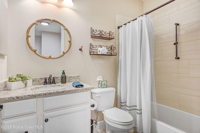 bathroom featuring vanity, toilet, and shower / bath combo with shower curtain