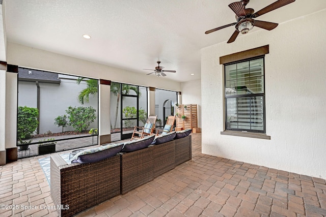 view of patio featuring an outdoor hangout area and a ceiling fan