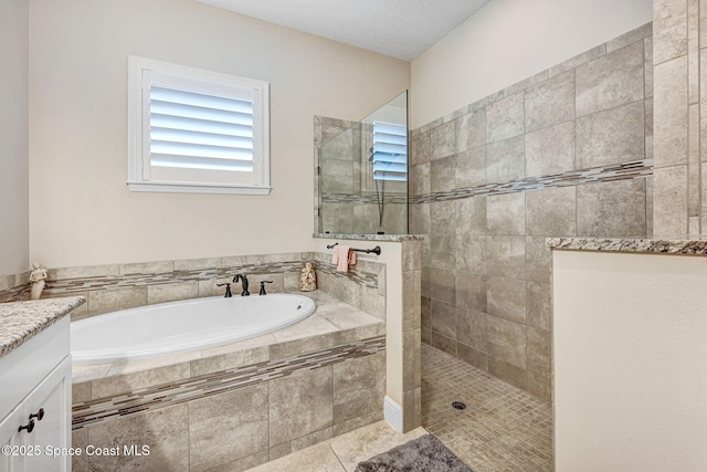 full bath featuring a bath, tile patterned flooring, and a walk in shower