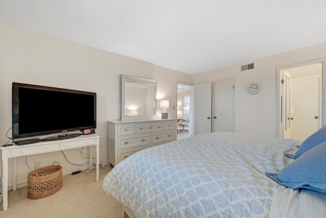 bedroom featuring carpet floors and visible vents