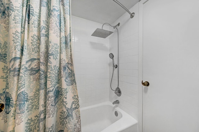 bathroom featuring shower / bathtub combination with curtain