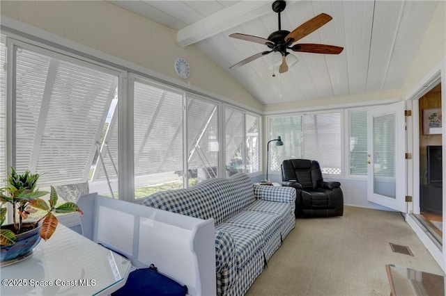 sunroom / solarium with lofted ceiling with beams, visible vents, and a ceiling fan