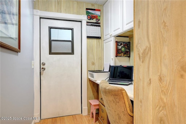 office with light wood-type flooring