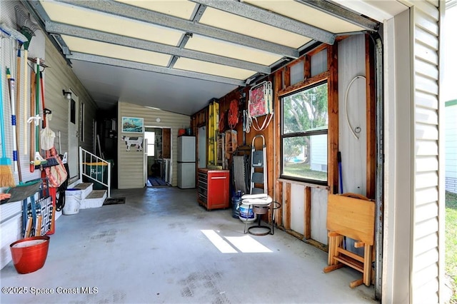 garage with freestanding refrigerator