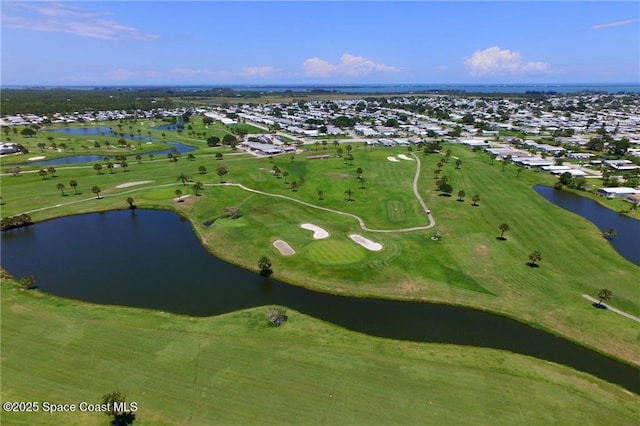 aerial view with a water view and golf course view