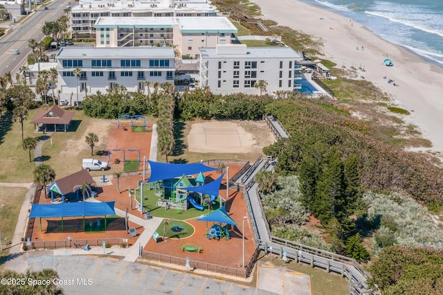 aerial view featuring a water view and a beach view