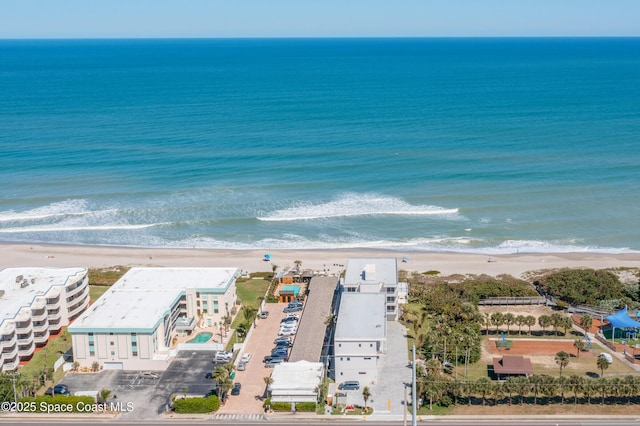 bird's eye view with a view of the beach and a water view