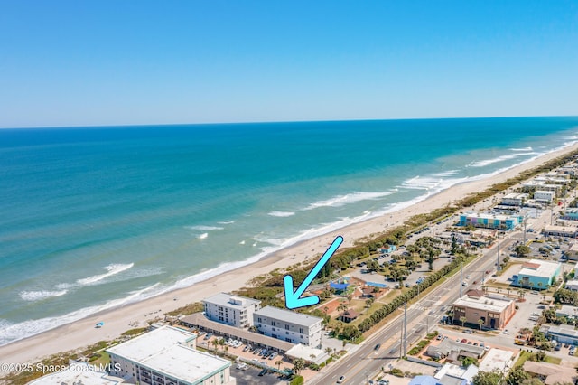 bird's eye view with a view of the beach and a water view