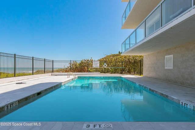 pool featuring a patio and fence