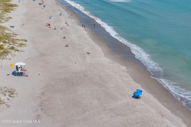 birds eye view of property with a view of the beach and a water view