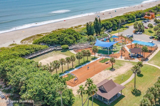 drone / aerial view with a water view and a view of the beach