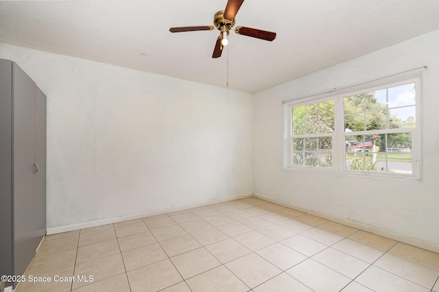 spare room featuring ceiling fan