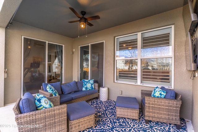 view of patio with ceiling fan and an outdoor hangout area