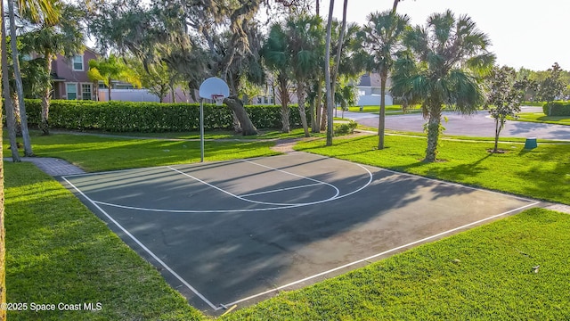 view of basketball court featuring community basketball court and a lawn