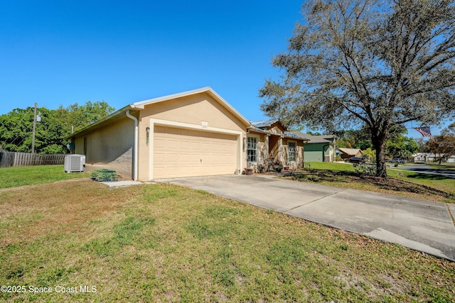 ranch-style house with central AC unit, an attached garage, fence, stucco siding, and a front lawn