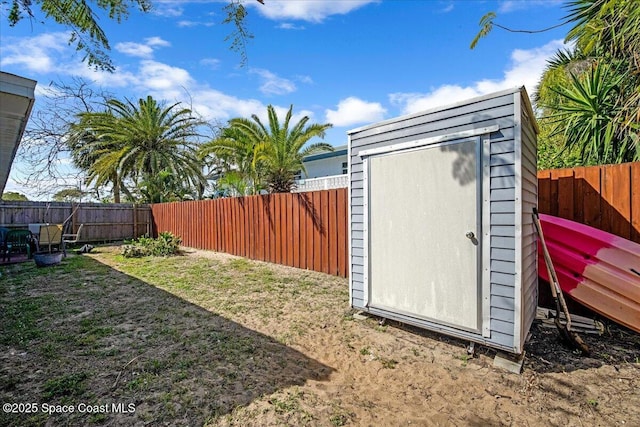 view of shed featuring a fenced backyard