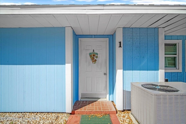 entrance to property featuring central AC