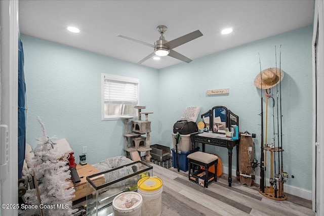 miscellaneous room with recessed lighting, a ceiling fan, and wood finished floors