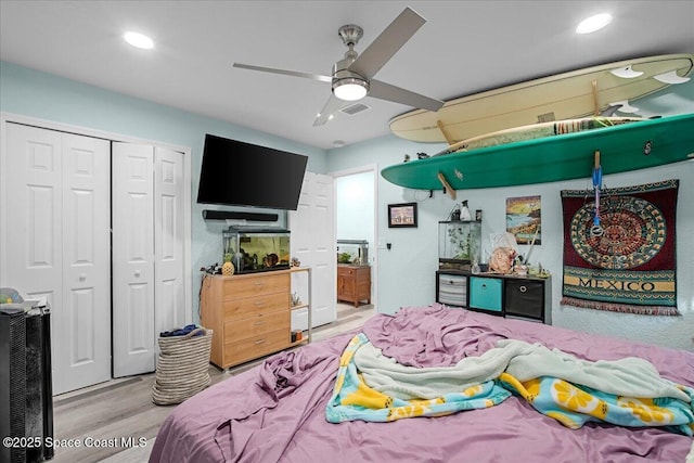 bedroom with recessed lighting, wood finished floors, a closet, and ceiling fan