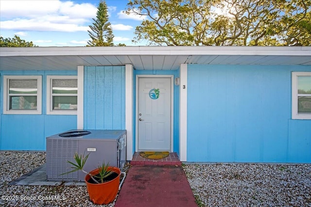 doorway to property with central AC