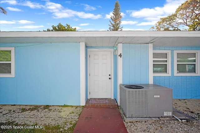 doorway to property with central AC unit