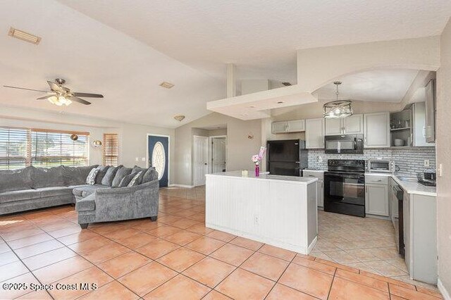 kitchen with open floor plan, black appliances, light tile patterned flooring, and open shelves