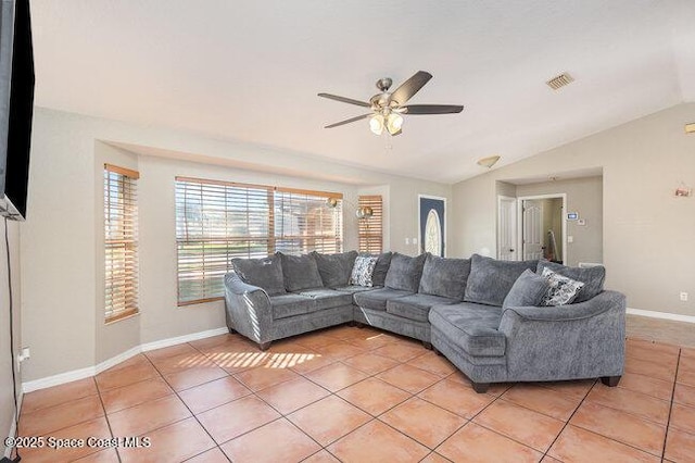 living room with baseboards, visible vents, a ceiling fan, vaulted ceiling, and light tile patterned flooring