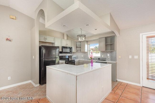 kitchen featuring decorative backsplash, a kitchen island, vaulted ceiling, black appliances, and open shelves