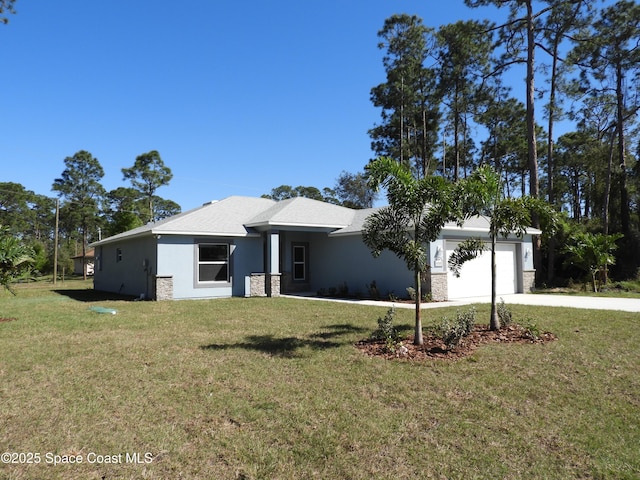 view of front of property with a garage, concrete driveway, stone siding, a front lawn, and stucco siding