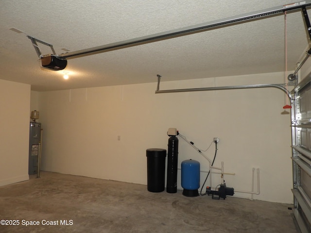 garage with water heater and a garage door opener